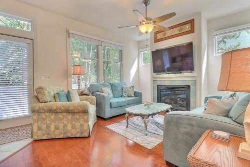 a living room with two couches and a fireplace at BB47 - A Wave From It All in Kill Devil Hills