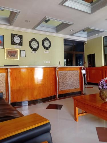 a waiting room with clocks on the wall at New Tourist Hotel in Mwanza