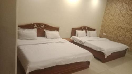 Ένα ή περισσότερα κρεβάτια σε δωμάτιο στο Raj Mahal Inn Pvt Ltd
