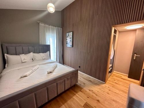 a bedroom with a large bed with white pillows on it at BERG & BERG HOTEL - Kerns Self-Check-in in Kerns