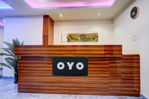 an office lobby with an ovo sign on the wall at Hotel O The Silver Stone in Guwahati