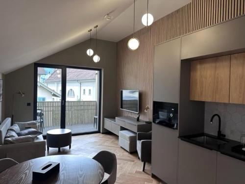 a living room with a couch and a table at BERG & BERG HOTEL - Kerns Self-Check-in in Kerns