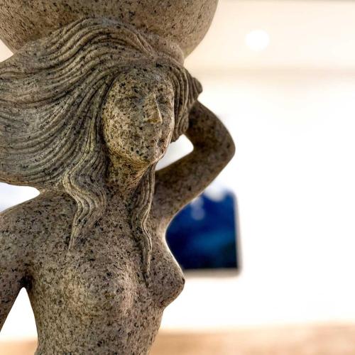 a statue of a woman with her head in her hands at Wander- und Familienhotel Erika in Wagrain