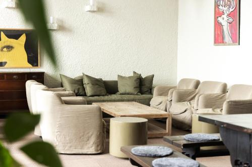 a living room with a couch and a table at Kogakuro in Myoko