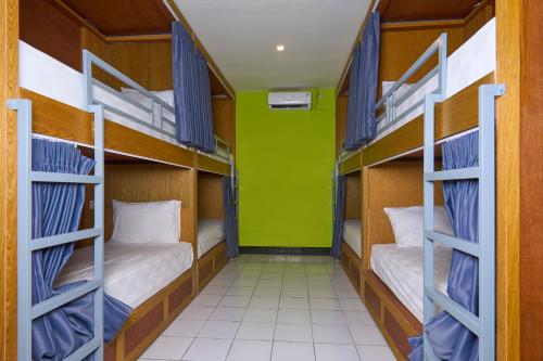 Postel nebo postele na pokoji v ubytování Attara Hostel Senggigi