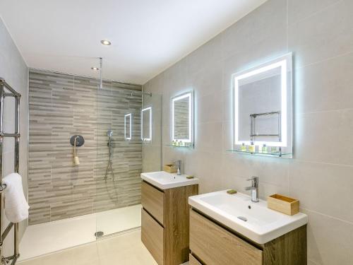 a bathroom with a sink and a shower at Howell Hall Barn in Howell