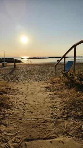 a sandy beach with a volleyball net on it at Sake' Beach in Senigallia