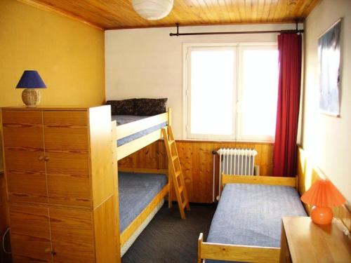 Postel nebo postele na pokoji v ubytování Résidence Paradis B - APPARTEMENT 2 PIECES -ALPE D'HUEZ QUARTIER DU VIEL ALPE MAE-9603