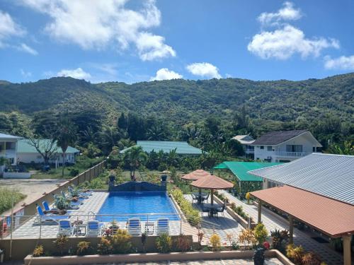 an aerial view of a pool at a resort at Praslin Orchid Villa in Grand Anse