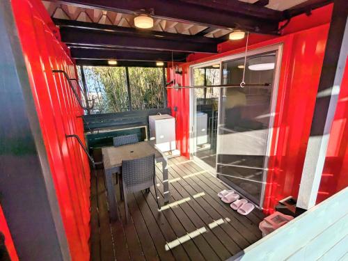 a screened in porch with a table and a keyboard at Backshore 99 in Kujukuri