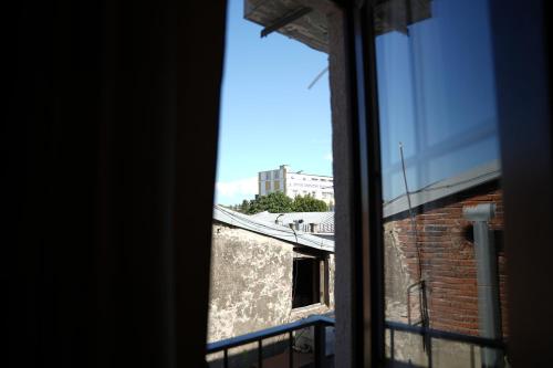 a view from a window of a brick building at Hotel BABU in Kutaisi