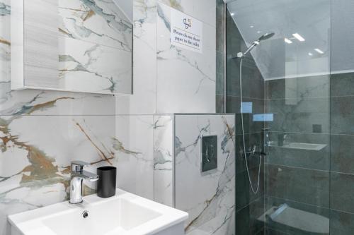 a bathroom with a sink and a shower at Emerald Island Residential Complex in Skala Rachoniou
