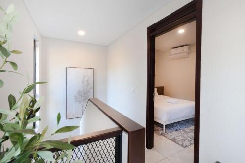 a staircase leading to a bedroom in a house at Arumnala with butler and Breakfast at KBP in Gantungan