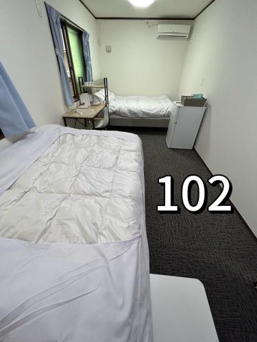 Postel nebo postele na pokoji v ubytování Sun flower Guest house
