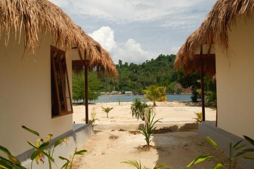 a view of the beach from a house at Uma Resort Togean in Katupa