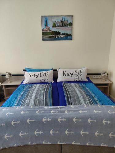two beds sitting next to each other in a bedroom at Haus Troja in Warnemünde