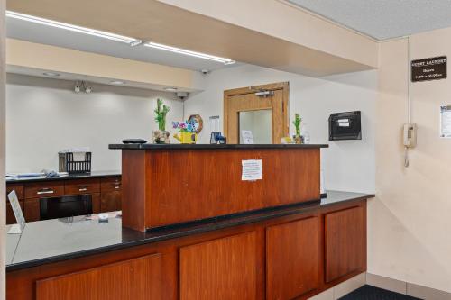 a waiting room with a counter in a hospital at StayInn Grand Forks in Grand Forks