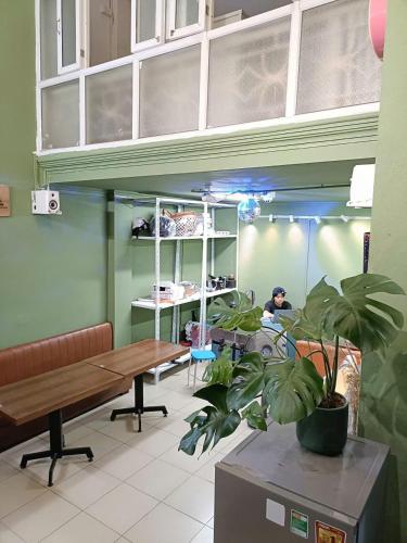 a room with a table and plants in it at Viet Vintage Hostel n Pub - Soft mattress - Free Breakfast in Hanoi