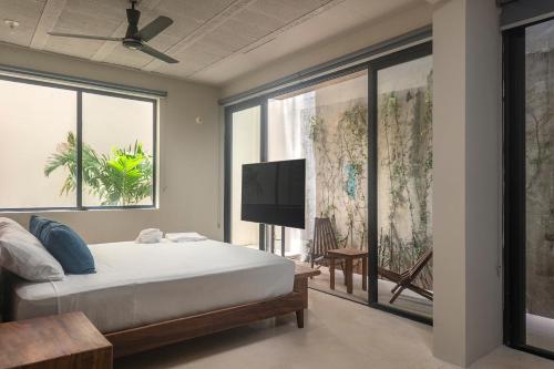 En eller flere senge i et værelse på MK Playa del Carmen