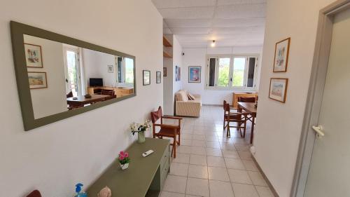 a hallway with a living room and a dining room at la casa nell'acqua in Otranto