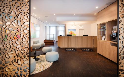 a lobby of an office with a reception desk at Art Hotel City Leipzig in Leipzig