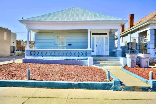 a home with a blue house with a porch at Entire Home Near UTEP in El Paso