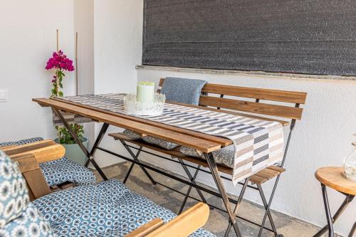 a table and chairs with a candle on it at Memory House - The place where your summer story begins in Skála Foúrkas