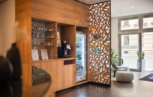 a room with a store with a glass door at Art Hotel City Leipzig in Leipzig