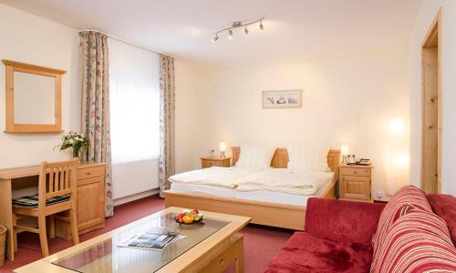 Postel nebo postele na pokoji v ubytování Hotel Schweinsberg