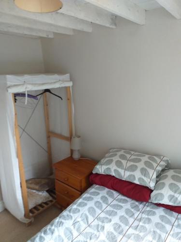 a bedroom with a bed and a nightstand next to a bunk bed at Willsgrove House in Athy