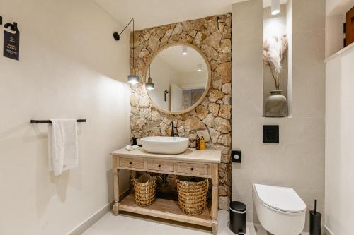 a bathroom with a sink and a mirror at Boutique Hotel & Spa Casa del Mare - Mediterraneo in Herceg-Novi
