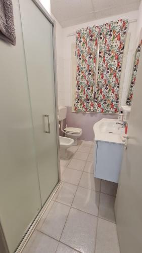 a bathroom with a shower and a sink and a toilet at la casa nell'acqua in Otranto