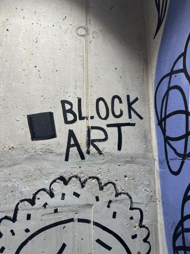a wall with the words blox art on it at Haas Apartments Art with parking, bakery, coffea in Brno