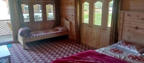 Ένα ή περισσότερα κρεβάτια σε δωμάτιο στο Green Land Guest House