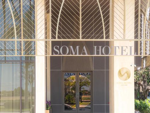 a building with a sign that reads soma hotel at SOMA HOTEL Riverside in Phnom Penh