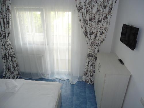 Ένα ή περισσότερα κρεβάτια σε δωμάτιο στο Hotel Nova Residence