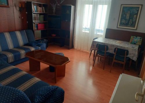 a living room with a couch and a table at Largo in Crikvenica