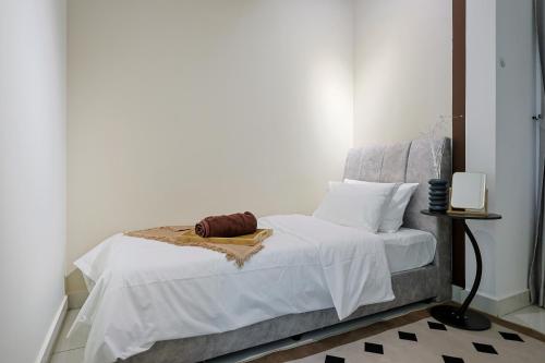 a bedroom with a bed with white sheets and pillows at Greenfield Residence, Bandar Sunway by The Comfort Zone in Petaling Jaya