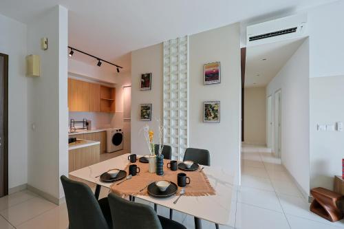 a kitchen and dining room with a table and chairs at Greenfield Residence, Bandar Sunway by The Comfort Zone in Petaling Jaya