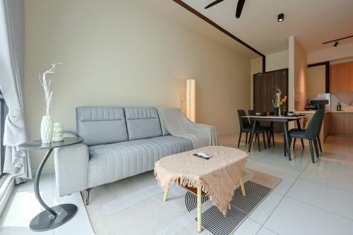 a living room with a couch and a table at Greenfield Residence, Bandar Sunway by The Comfort Zone in Petaling Jaya