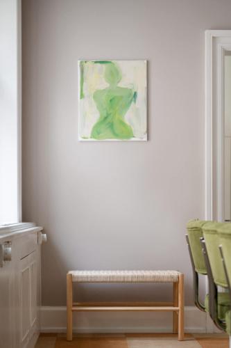 a room with chairs and a picture on the wall at The Churchill manor apartments by Daniel&Jacob's in Copenhagen