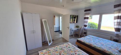 Ένα ή περισσότερα κρεβάτια σε δωμάτιο στο Ferienhaus an der Ölmühle