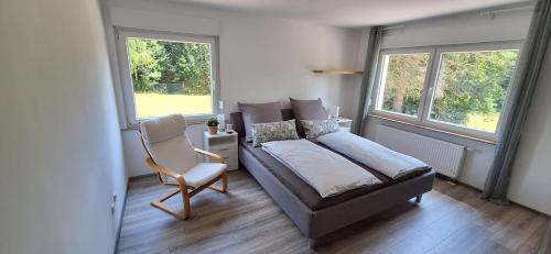 Ένα ή περισσότερα κρεβάτια σε δωμάτιο στο Ferienhaus an der Ölmühle
