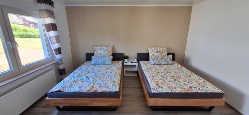 Ένα ή περισσότερα κρεβάτια σε δωμάτιο στο Ferienhaus an der Ölmühle