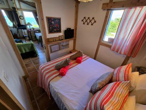 Postel nebo postele na pokoji v ubytování Cottage Cantinho da Quinta