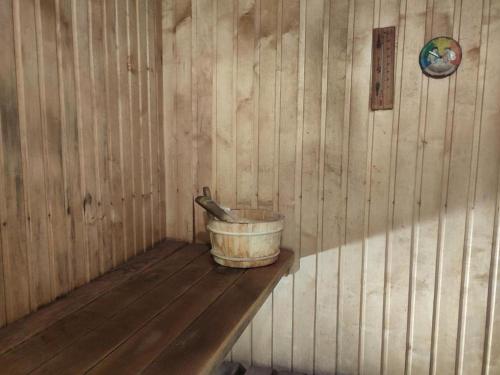 a bucket sitting on a shelf in a wooden room at Veski talu aidamaja 