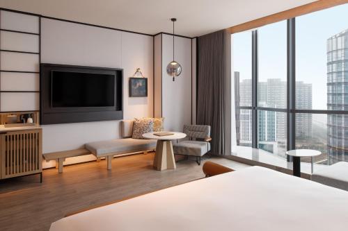 Uma cama ou camas num quarto em Sheraton Xi'an Chanba
