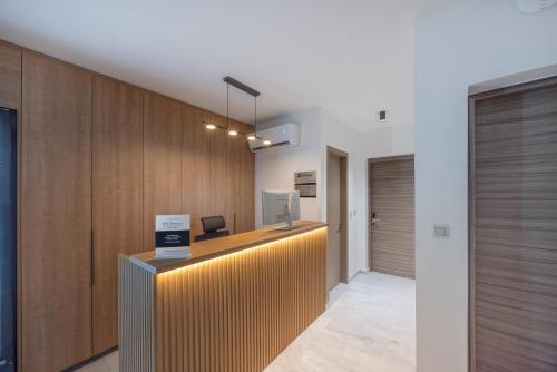 an office with a reception desk in a building at Sokio Attiki Hotel, BW Premier Collection in Athens