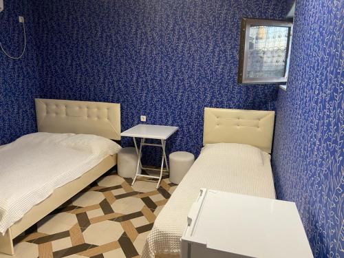 Rúm í herbergi á Hotel Kvadrati