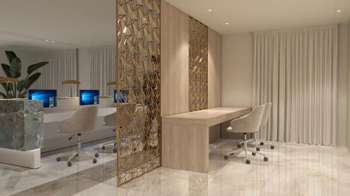 a office with a desk and chairs in a room at SH Jávea in Jávea